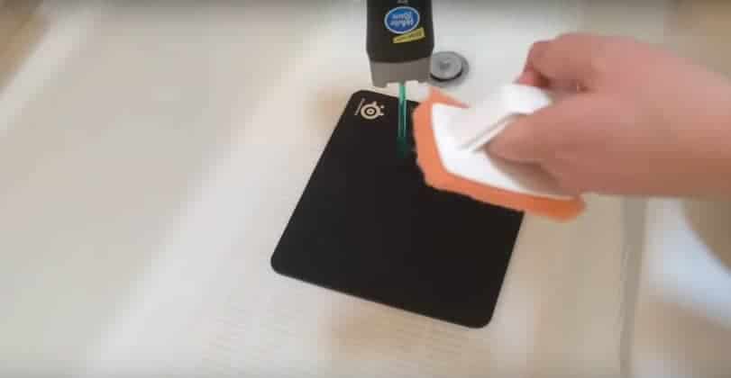 Clean the mouse pad with a soft brush