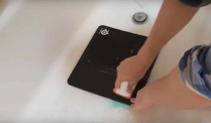 Clean the mouse pad with dish SOAP